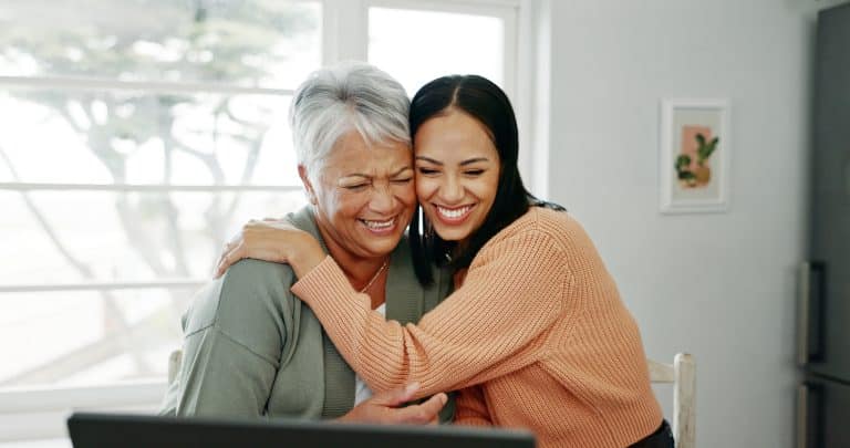 Elderly woman with her middle aged daughter